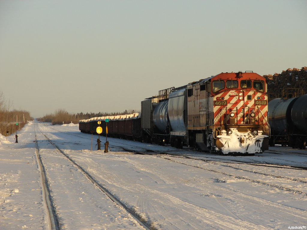 CN 571, BCOL 4619 arrived overnight to an empty Hearst yard and the crew elected to head straight for bed before dealing with the train. Normally the crew will wye their power for the trip home before pulling the train in, yarding their train and put the power on another track in front of the station. There are actually several railways at play here, a CN train in an ONR yard using BC Rail power with traffic from CN/CP/ACR to ONR manned by an Algoma Central crew!