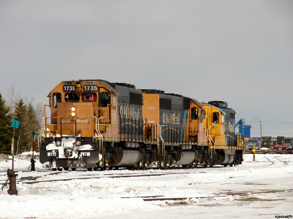 ONT 213 - ONT 1735 North has yarded it's train and is snaking through the crossovers to spot the power on the shop lead, where a hostler will come out to chop off/take 1603 to the shops on it's own while the crew prepares to "turn and burn" back to Englehart as 414 with 1734 leading later this evening.