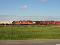 CP 9582 South slowly creeps up to the light at the South end of Baxter as they hold the siding with their train (608-433) while CP 113 flies by on the main, only going as far as the North end to wait for another 608! Oil is big business on CP these days. 