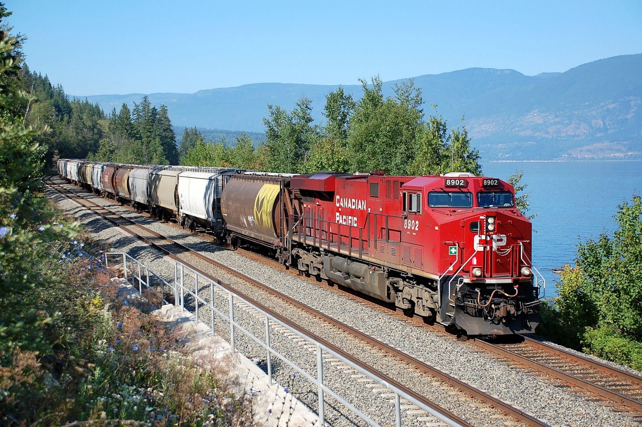 CP 8902 is cruising alongside Shuswap Lake and approaching Mowitch with this eastbound load of empty grain cars.