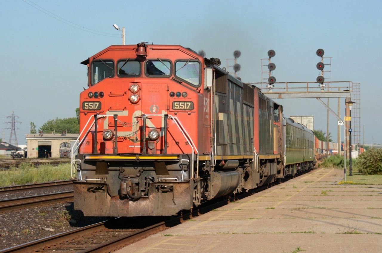 CN5517 with CN2440 pulls into Sarnia with a couple of vintage passenger units.