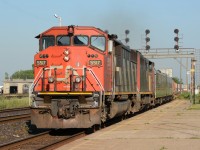 CN5517 with CN2440 pulls into Sarnia with a couple of vintage passenger units.