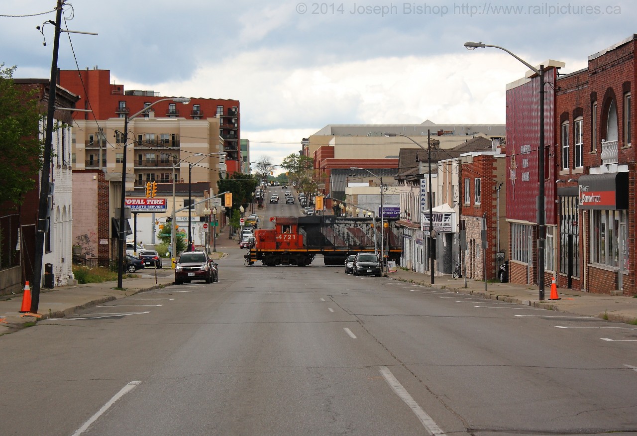 CN 580 breaks the silence in downtown Brantford as CN 4724 blows for Colborne Street on its way to Ingenia.