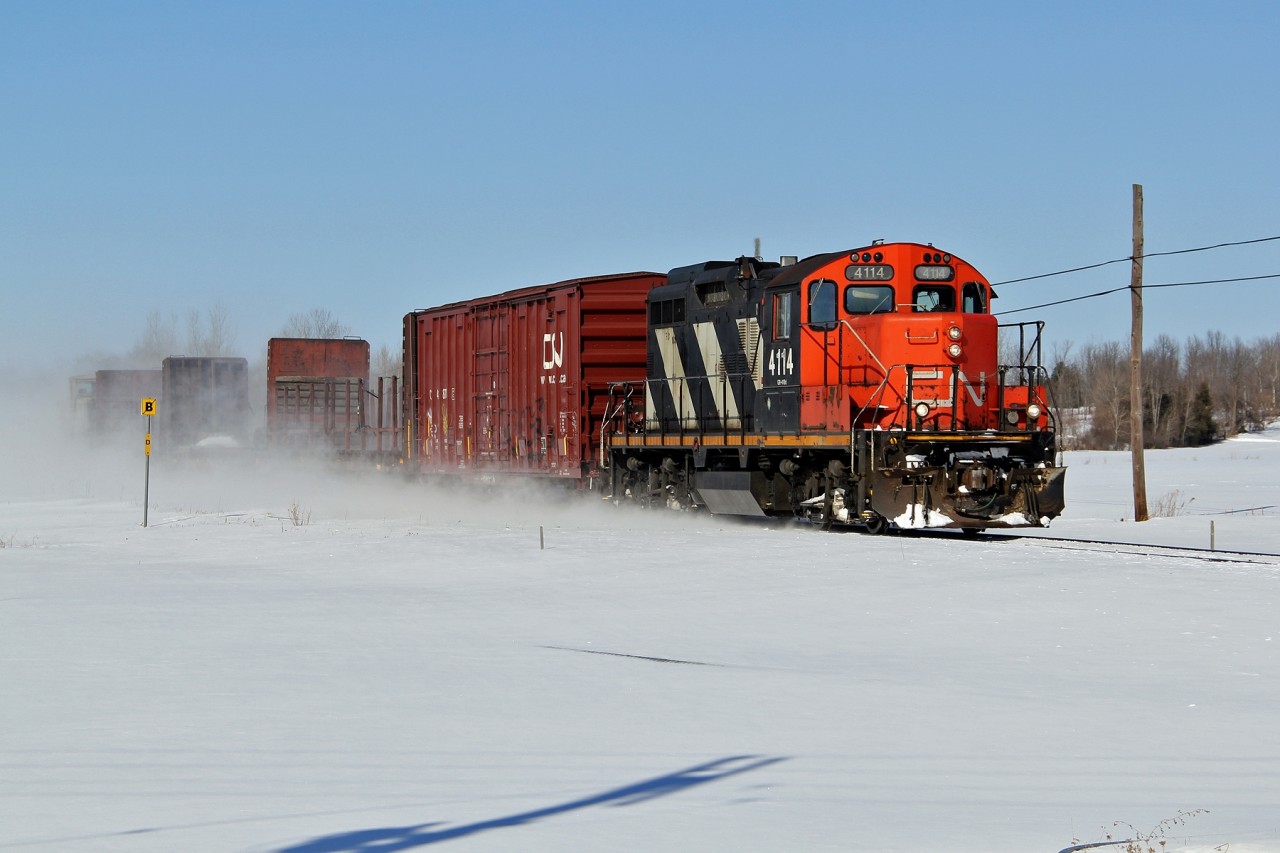 CN 4114 travels East on VIA Rail's Alexandria Sub with CN 589.