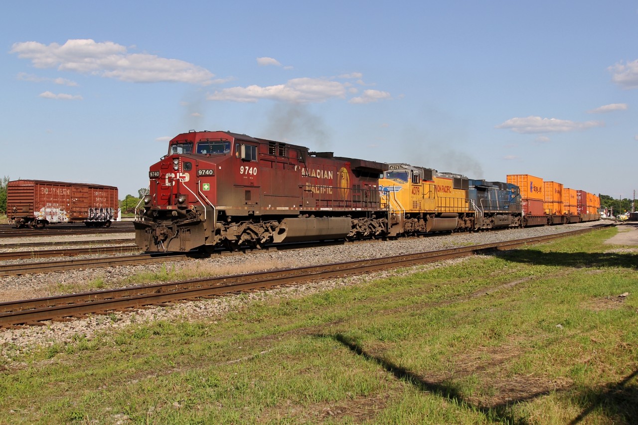 CP 9740, UP 4379 and CEFX 1052 depart from Smiths Falls with CP 143.
