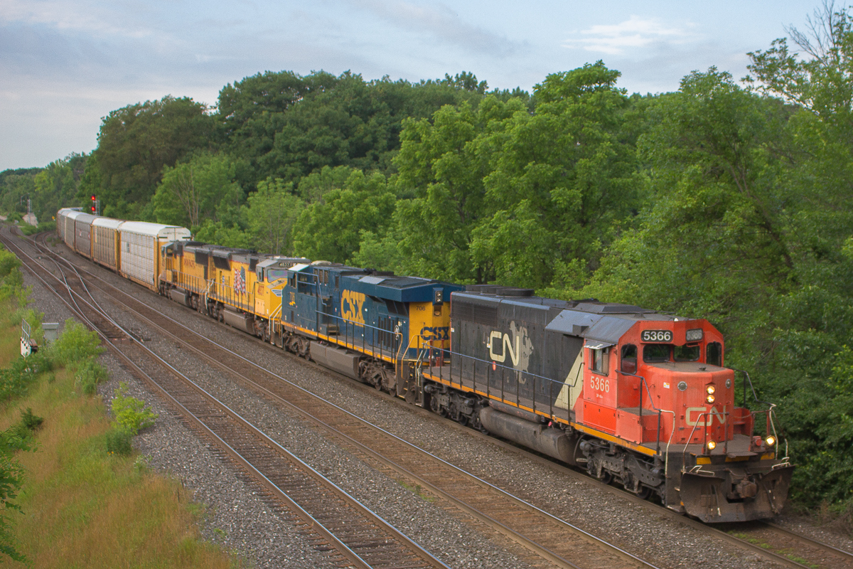 Thanks to a heads up posted on Facebook, I found out about this CN X396 that was headed from Sarnia. I got up at 7am, expecting the train had just departed a short while earlier. Turns out the train was already in London, so I quickly got ready and went to Burlington. The rush was not needed, as I waited a good 40 minutes, but it doesn't matter. A couple railfans were on hand at Bayview, however for some reason I was expecting a larger turnout. After a good wait, CN 5366 rounded the corner CSX 706, UP 4837, and UP 4529. I couldn't have asked for a better lashup. This wouldn't be my first time seeing CN 5366, as I saw it six years ago in Niagara, and more recently on CN 330 and 331 paired with an NS C40-8W. Everytime I've seen it, this old-timer seems to bring good power along with it.