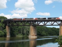 At last a freight on the viaduct! Having seen the green light at Paris Junction I managed to reach the viaduct downtown with plenty of time to spare. With one eye on the water snake sunning itself next to me I was surprised to see an oil train with all CN power CN 2221, 2525 and 5505.