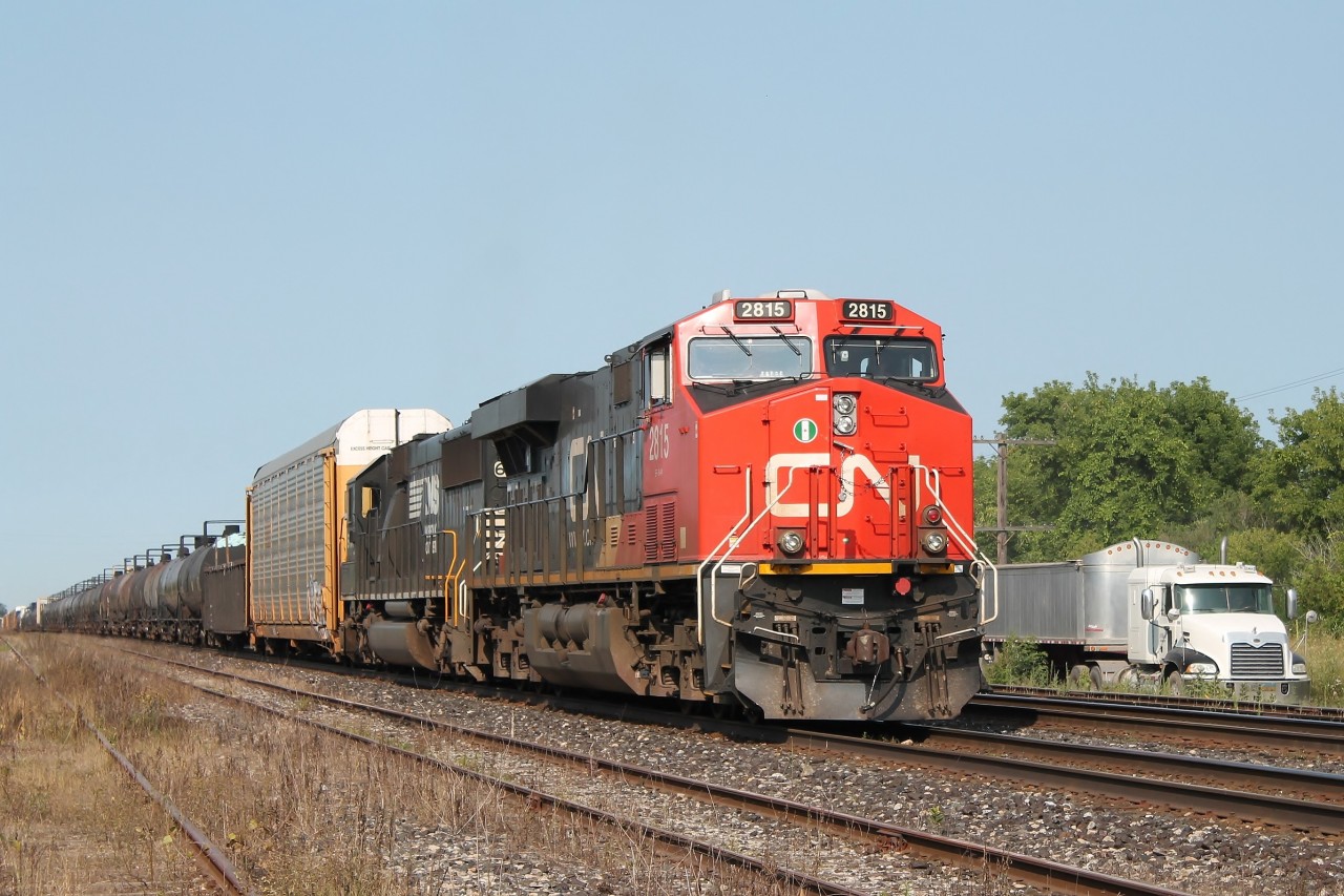 Having arrived later than normal I was surprised to see 2815 stopped on the yard. One of the other photographers there, told me they were having trouble with the trailing unit-NS SD60 6707. After a west bound passed on the north track the train headed east rapidly picking up speed on the south track!