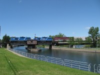 
The MMA switcher #810 with 2 leased engine , stopped on the swing bridge over the Chambly canal in St-Jean sur Richelieu !

Since July 1st 2014 , The Montréal,Maine and Atlantic Railway was disbanded and replace by the new Railroad company , Central Maine and Québec Railway !!