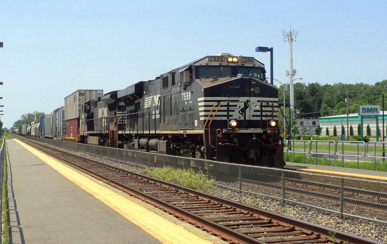NS 7598 and NS 8393 a C-40-8w pulling a convoy of mix cars