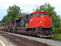 CN-8007 a SD-70m2 leading loco with loco CN-5659 SD-75I -s also CN-2182 C-40-8w pulling a containers convoy going to the Maritimes up to Halifax N.S.CN-8007 logo CN logo almost all gone