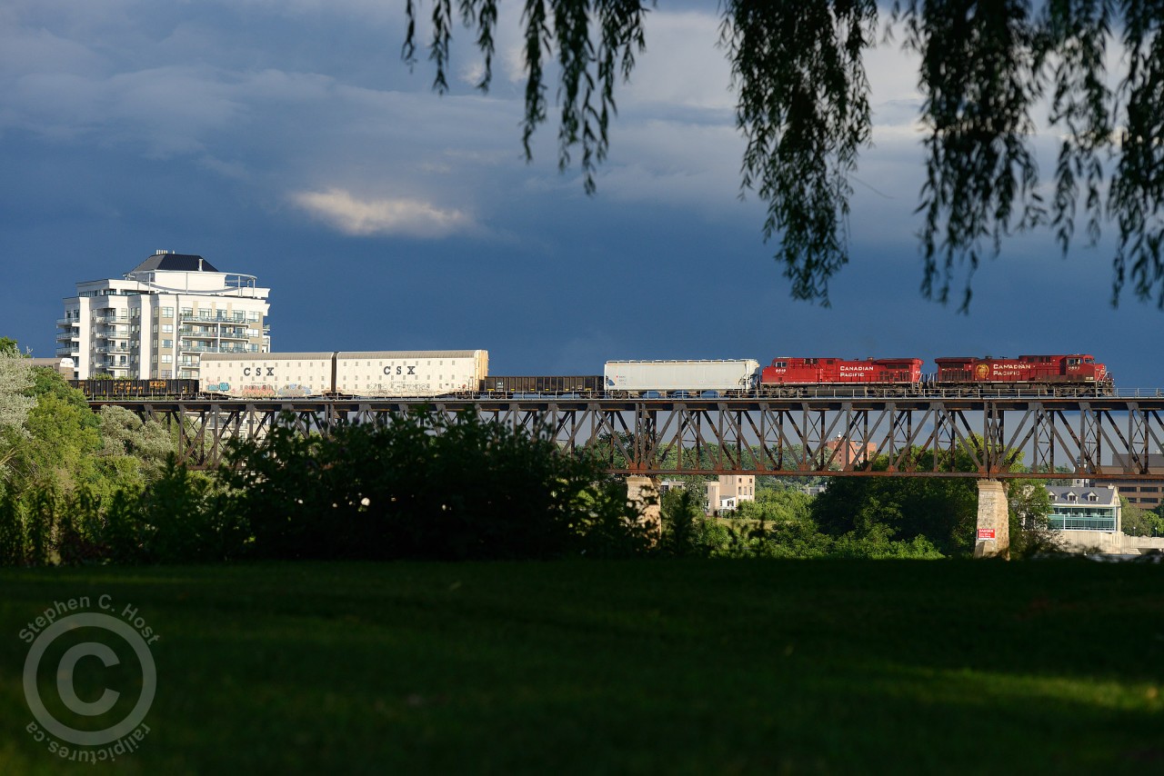 Train 255 crosses westbound to meet 254 at Wolverton while the historic downtown Galt glistens in the evening light.