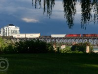 Train 255 crosses westbound to meet 254 at Wolverton while the historic downtown Galt glistens in the evening light.