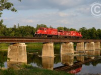 TG21 with a GP9 sandwich with fresh bread is northbound on the CPR Waterloo subdivision. TG21's work was to bring loaded racks to Galt from Hagey, then run light to South Junction (Mile 11.2) lift about 40 cars from the GEXR/CN interchange to bring back south. Photo is at Freeport, about mile 7.5. Taken with a 50mm F/1.8 at f/5.6, ISO 400.