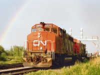Late day showers resulted in this rare opportunity to catch CN within the confines of a rainbow as the train exits Fort Erie heading for Toronto. Power is CN 9577 and 2313. Lead unit converted to a GP40LH-2 for the Massachusetts Bay Transit Authority by 1997, and the 2313; well, it met the fate of all mainline CN MLWs on the roster: Retired. In this case, by 1996.
