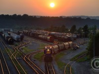 Bay St. bridge is finally open again and the 1900 Hamilton job (aka 495) is seen toiling away under the hot summer sun. A thick  purple haze filters the last rays of the deep orange sun - casting brown shadows along the escarpment. Any sailor would know to heed warning with an angry sky like this - later that night we had quite a good thunderstorm.