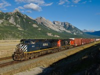 BCOL C44-9W 4653 and CN C40-8 2098 throttle away from Henry House after receiving a better (limited to clear) signal running on the block of train M304 ahead.