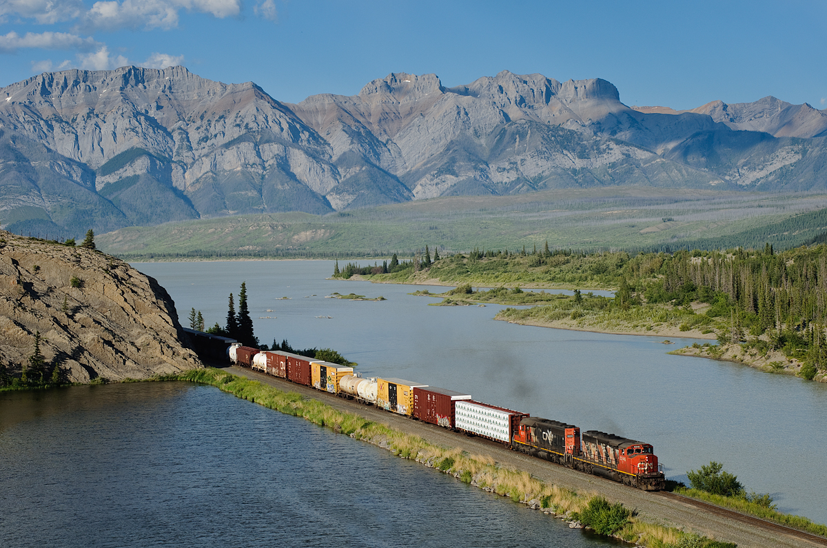 CN SD40-2W 5246 and CN SD40u 6011 grind towards Jasper with 64 cars from Hinton and Swan Landing. They'll split them up into east and west traffic for mainline trains to lift at Jasper, and then return to Swan Landing and Hinton with empties.