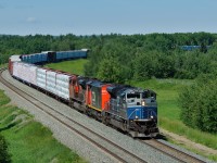 CN 8103, a former EMD SD70ACe-P6 demonstrator unit leads Prince George-Winnipeg train M304 down the siding at Evansburg to meet train A417.