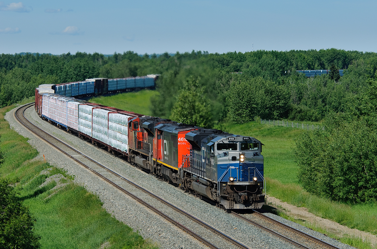 CN 8103, a former EMD SD70ACe-P6 demonstrator unit leads Prince George-Winnipeg train M304 down the siding at Evansburg to meet train A417.