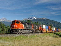2nd section Q11252-01 (Kamloops-BIT) speeds away from Jasper passing mile 229 on CN's Edson Subdivision on a nice summer evening.