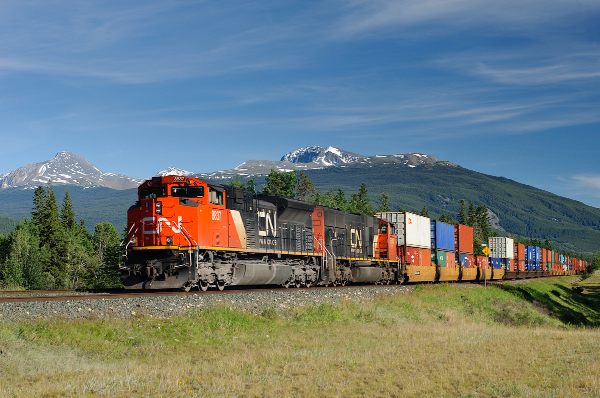 2nd section Q11252-01 (Kamloops-BIT) speeds away from Jasper passing mile 229 on CN's Edson Subdivision on a nice summer evening.