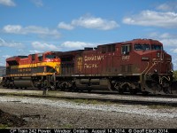 After CP 242 came over the border into Windsor, they shoved the train into Windsor Yard and tied down the power.  Fortunately they left it out where it was reasonably "shootable".  KCS SD70ACe #4051 adds a nice bit of color to the normal CP red that usually occupies the ready track here.
