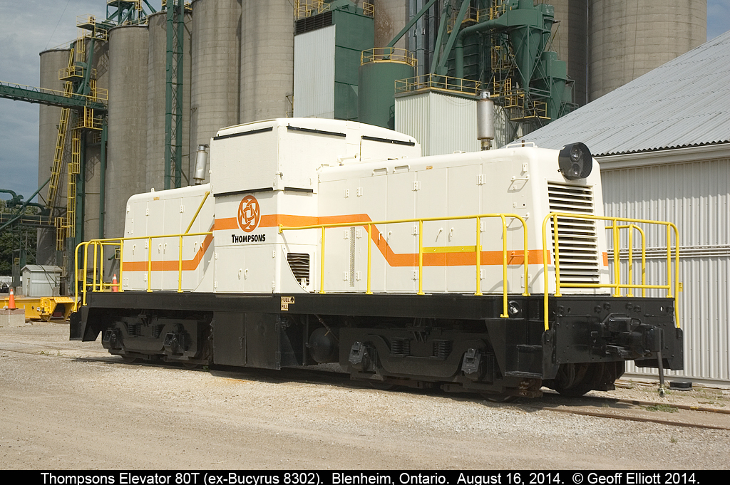 Thompsons Elevators GE 80Tonner, form Bucyrus 8302, seen @ http://www.railpictures.ca/?attachment_id=14906, is now seen in it's new colors as it rests quietly at the grain facility in Blenheim, Ontario.