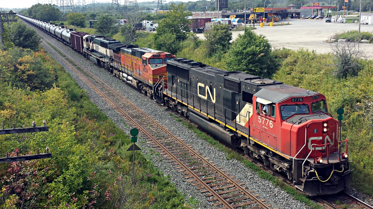 CN 5776 leads BNSF 4824 and BNSF 9815 (my very first BNSF executive scheme) with a train load of crude oil bound for the refineries in Quebec. Thanks dad for beating the traffic so we could catch this train.