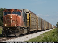 Hoping that CN had left the SD60F on 439 that had been back and forth for over a week I ventured out today and was saddened to see a lone, beat-up, CN SD75i #5744 leading a fairly long 439 through Rochester Township just outside of St. Joachim, Ontario.