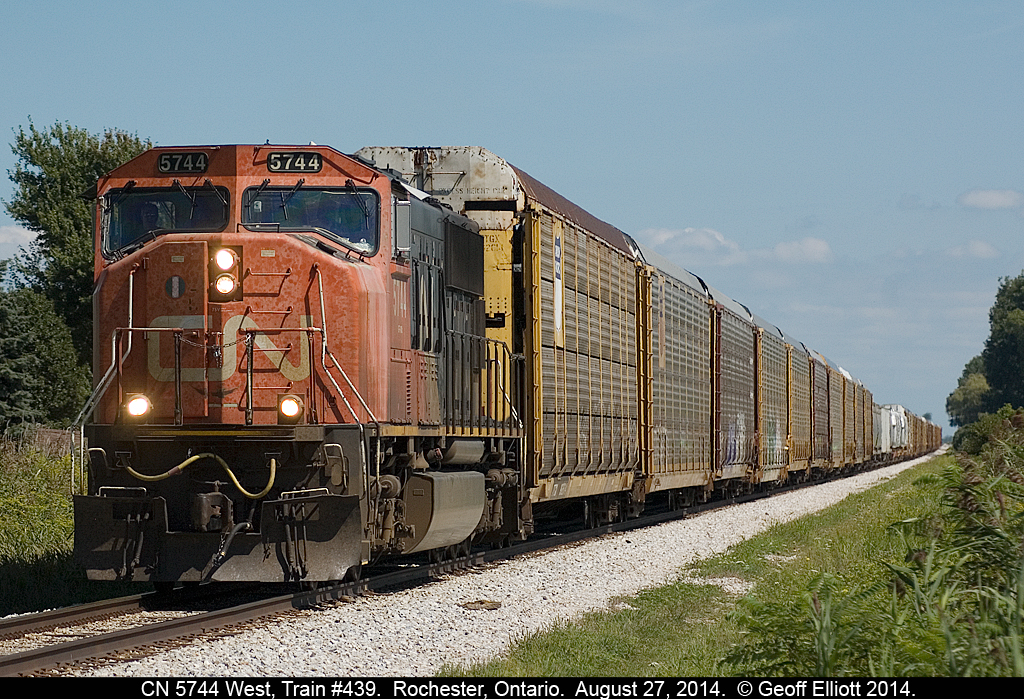 Hoping that CN had left the SD60F on 439 that had been back and forth for over a week I ventured out today and was saddened to see a lone, beat-up, CN SD75i #5744 leading a fairly long 439 through Rochester Township just outside of St. Joachim, Ontario.
