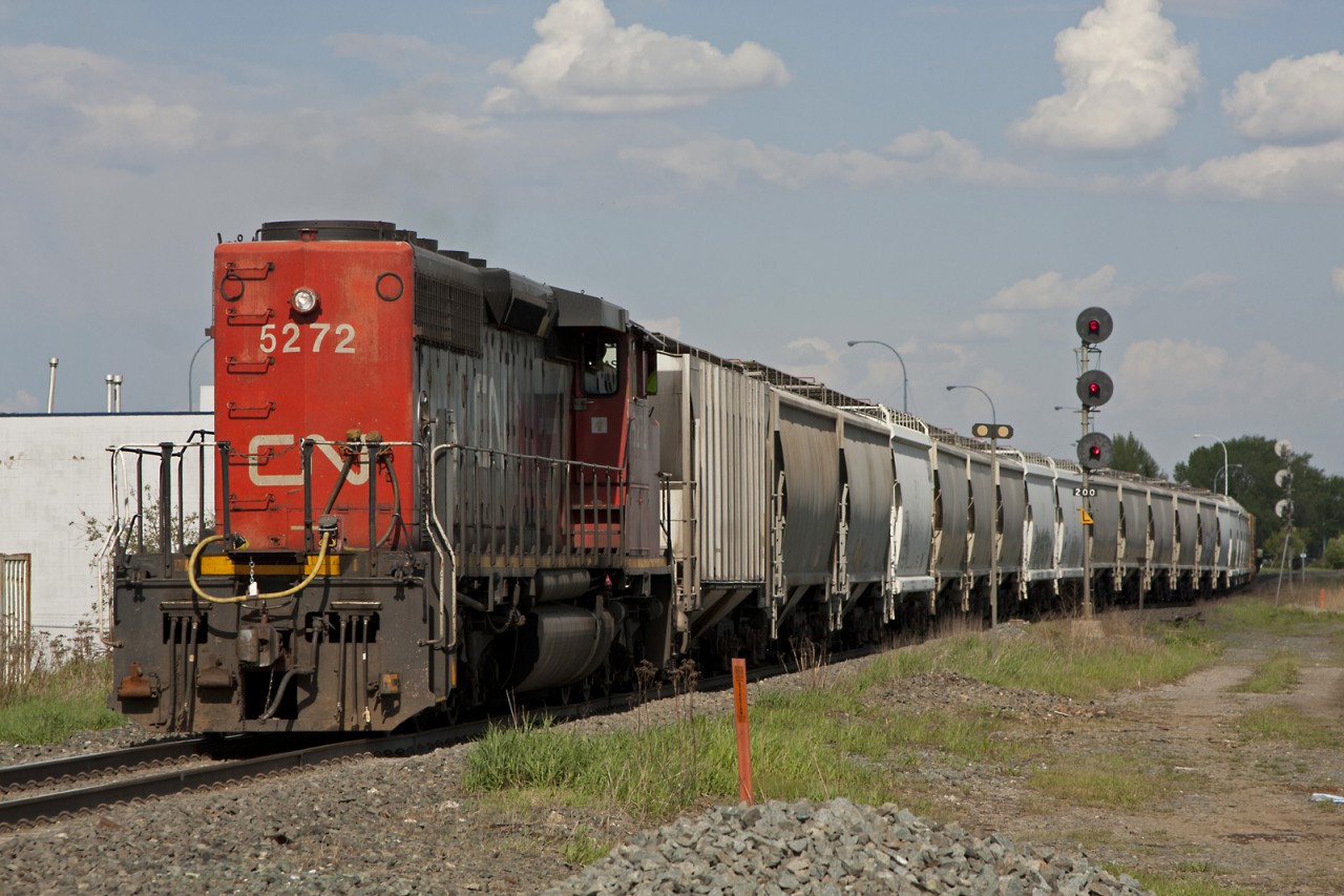 CN 5272 has just finished shoving its train from Carvel to Spruce Grove, a distance of 12 miles. The crew will leave the cars on the south track, run 10 miles east as a light engine to lift some cars from an industry track, then return to lift the rest of the train. Complecated and confusing move to say the least! Needless to say the crew did not sound too pleased!