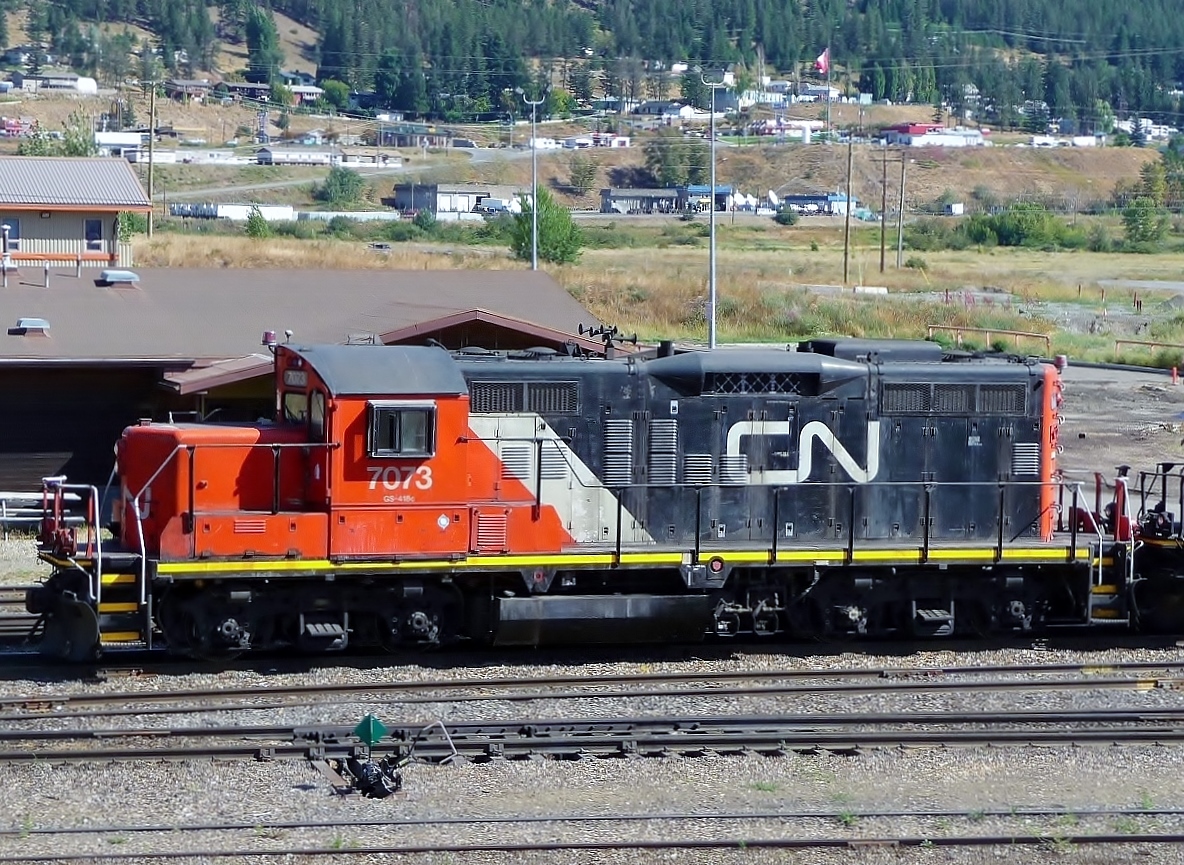 One of the local GP9u's idling in front of the depot after working the yard marshalling loaded centre beams.
