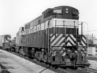 Running long hood forward, CP "Trainmaster" 8919 rolls south on the Galt Sub by West Toronto Station on a transfer run to Parkdale Yard. One of 21 FM/CLC H24-66 units built for the Canadian Pacific Railway in the 50's (8900-8920), they were the most powerful units of their time, and often used solo on transfer assignments in the Toronto area when this photo was taken. Those duties would later fall to the lone MLW RSD17: 8921 "The Empress of Agincourt". <br><br>Also note the sideways-blocked load in the trailing gondola.