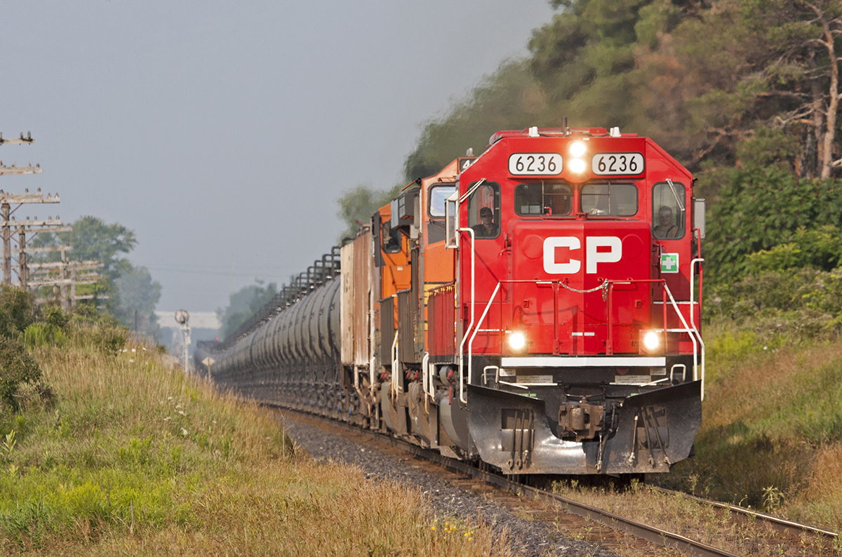 A former SOO SD60 and a pair of BNSF take charge of 640 as it hustles across Southern Ontario in perfect morning light. (CP 6236, BNSF 4515, BNSF 7275)