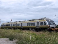 Early Thursday it had been confirmed that the first of the Nippon-Sharyo Diesel Multiple Units for the Union Pearson Express were on their way to Toronto. With this equipment poised to make significant impact on passenger rail in the Greater Toronto Area, it was only fitting to attempt to see them as they first arrived, despite the less than favourable photography weather and threatening clouds. I am surprised that I was not caught outside in the rain!

Before this train approached the Brampton Intermodal Terminal, a new 148 called himself out to head east, interestingly also symboled Q14891 13, leading to an interesting discussion between the crew and RTC. The RTC explained that since the trains were operating with identical symbols, they could not both be on the main track at the same time. The new 148 would not be able to leave until after the original 148 had entered the BIT. After making great time over the Dundas and Halton Subs, just 25 minutes from Mansewood to Torbram, this monster of a train ground to a crawl to enter the BIT. Those in the queues on Torbram Road not too impatient to watch the train slowly rumble by were rewarded with the sight of the new DMUs a whopping 29 minutes after the automatic warning devices were first activated. The delay was so lengthy that there was even an accumulation of pedestrian traffic - a rarity in the industrial jungle of the area - and a few of the pedestrians pulled out smartphones at the sight of the DMUs. I haven't found any of their photos on Twitter or Instagram, but the posts are likely to start popping up once the public becomes aware of the arrival.