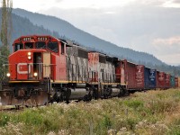 CN nos.5273 & 5305 are approaching Lavington on the Lumby sub with a load of empty centre beams.