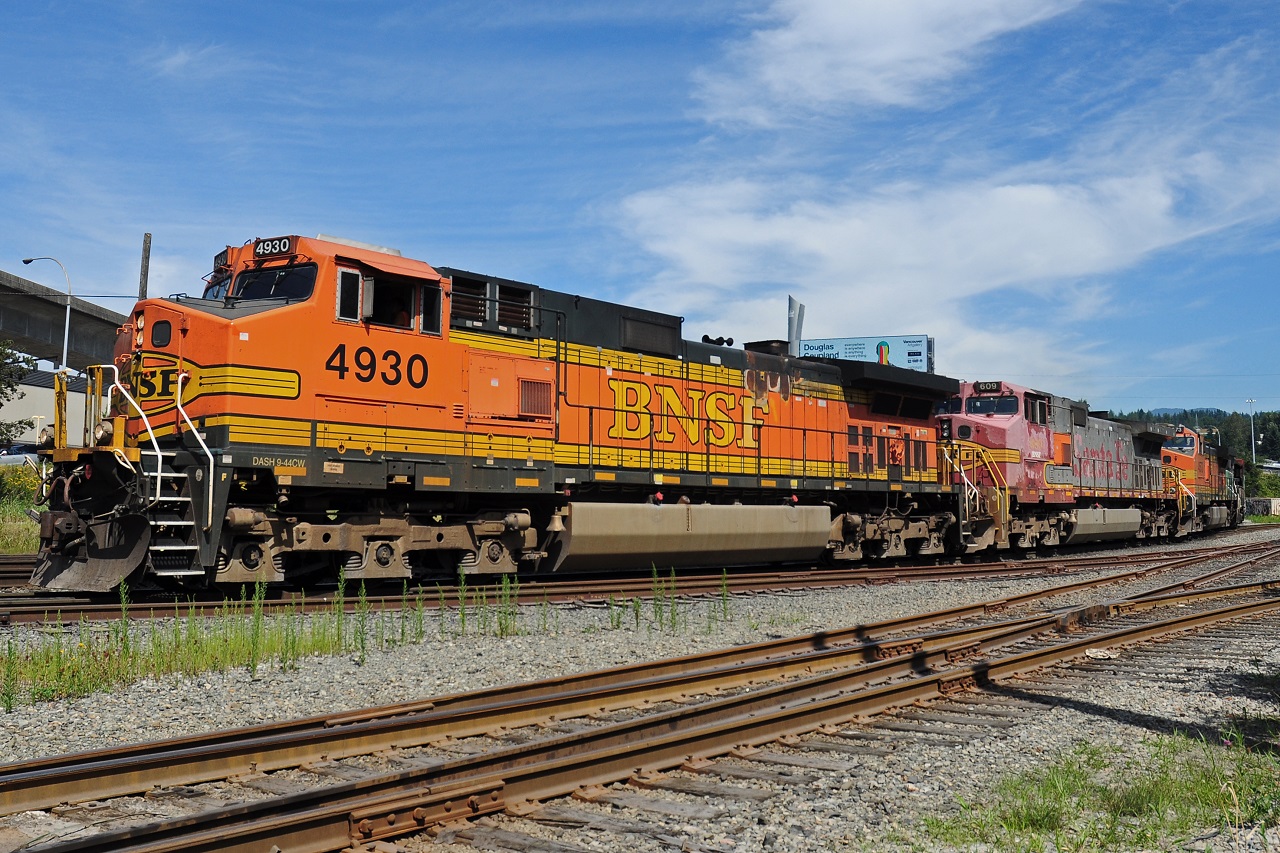 Some BNSF Dash 9's leading a mixed freight train out of Braid Junction in New Westminster, British Columbia.