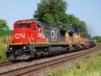 A pair of former Chicago & North Western C40-8s lead CN 331 around the curve just east of Garden Avenue.