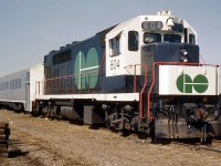 Painted in its proper colours from the "stealth" version it and its sisters wore in brief CN freight service, GO 604 is seen parked with a train of Hawker Siddeley Canada single-level commuter cars (based on the HSC RT-75 / TTC "H-series" subway car design) at Mimico in 1967. Of note, GO trains were maintained out of an old CN carshop in CN's old Mimico yards before the construction of Willowbrook shop a number of years later.
<br><br>
Before the official startup of GO Transit, these units did temporary runs in CN freight service in a modified paint scheme: <a href=http://www.railpictures.ca/?attachment_id=15870><b>http://www.railpictures.ca/?attachment_id=15870</b></a>