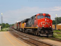 CN 2595 leads CN 332 through Brantford with a CEFX SD40-2 sandwiched between the two CN dash 9's.