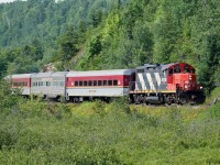 The southbound Agawa Canyon Tour Train, with CN GP9Rm 4110 on the southbound head end, approaches mile 10 just north of the former location of Odena siding on the former Algoma Central Railway.