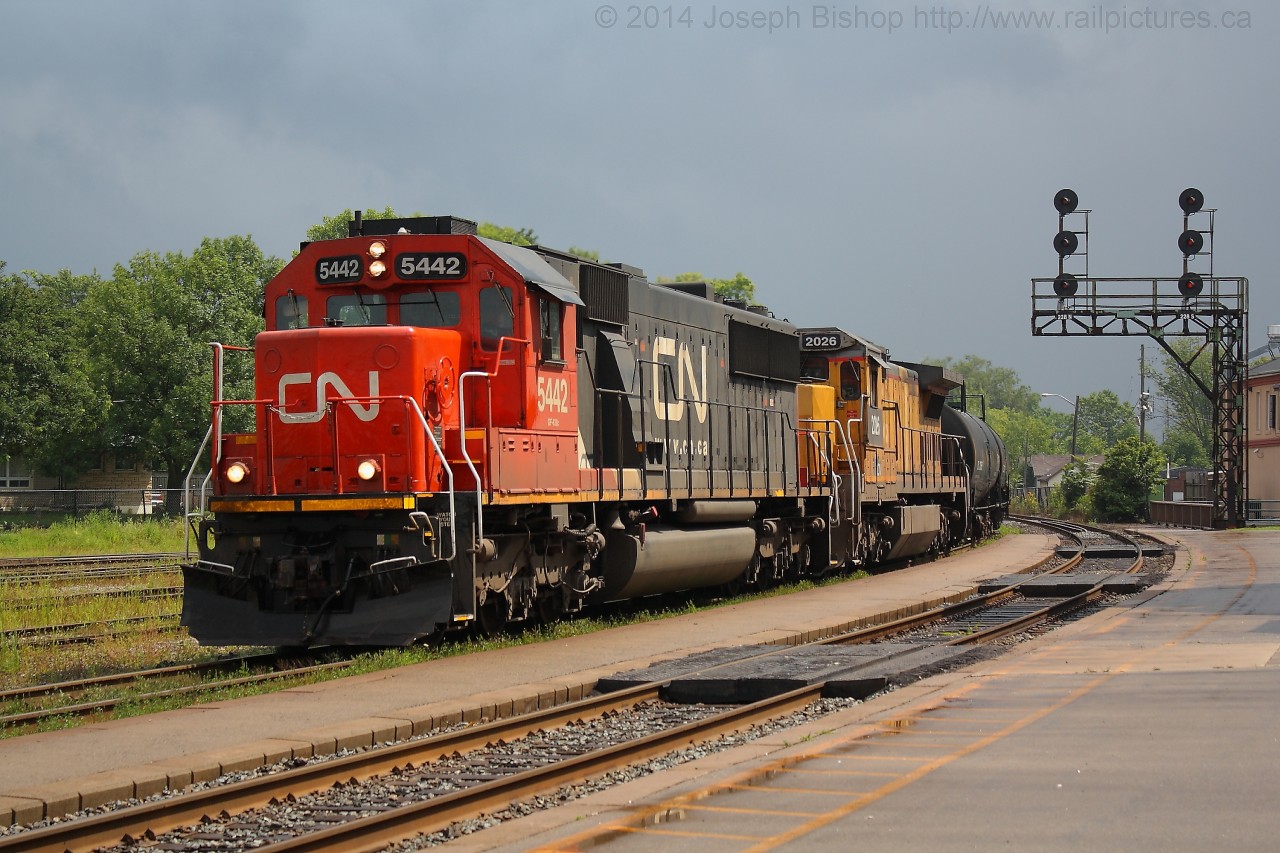 When I left the office at 12, it was pouring rain.  By the time I got to the station the rain had let up and about ten minutes later the sun was out and about ten minutes after that 331 showed up with CN 5442 and CN 2026 providing the power.