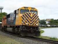 Ontario Northland's daily Englehart to North Bay freight train no. 214 round the curve along the shore of Cobalt lake at the former ONR Cobalt station.