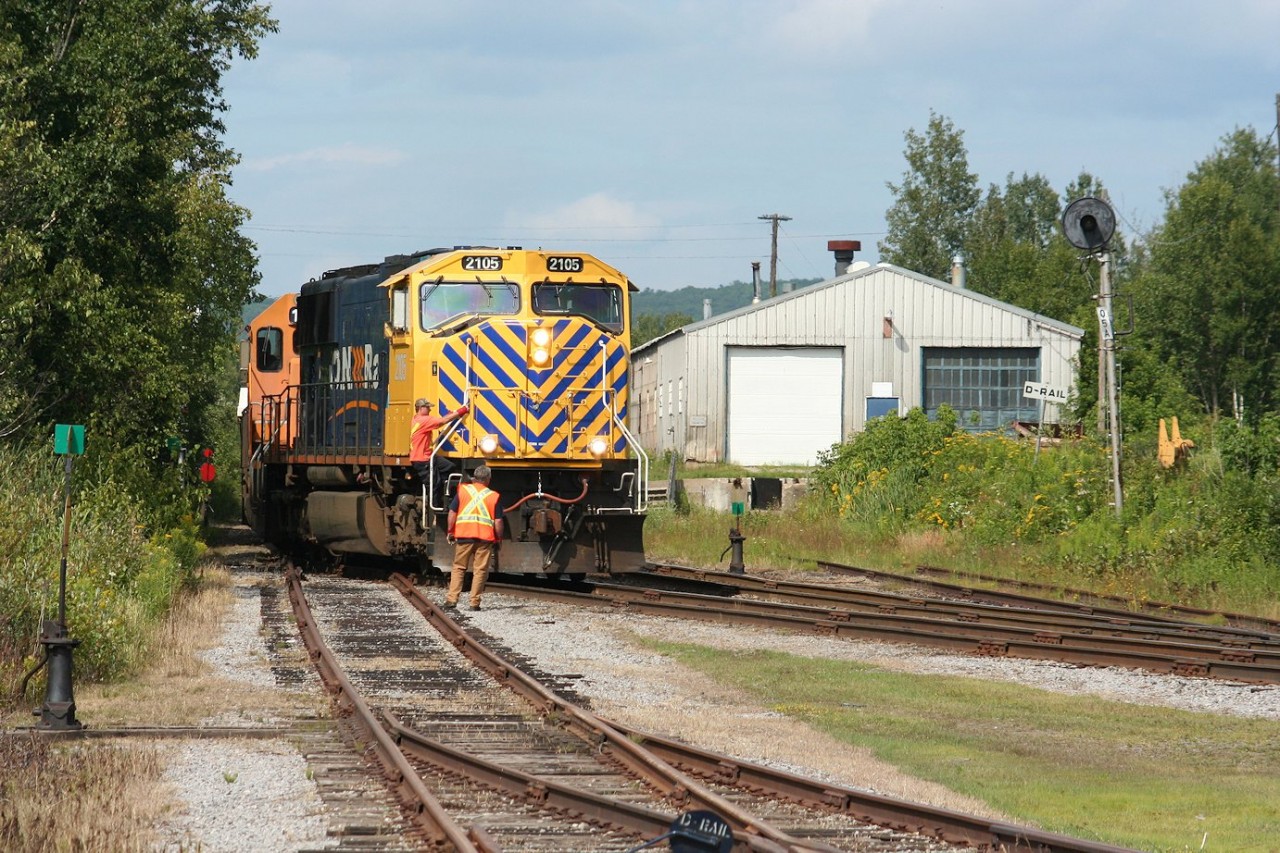 Southbound train no. 214 arrives at North Bay Yard, and the yard crew is ready to hop on board and take over the train from the inbound road crew who will disembark as the train slowly rolls across the grade crossing at the north side of the shops.