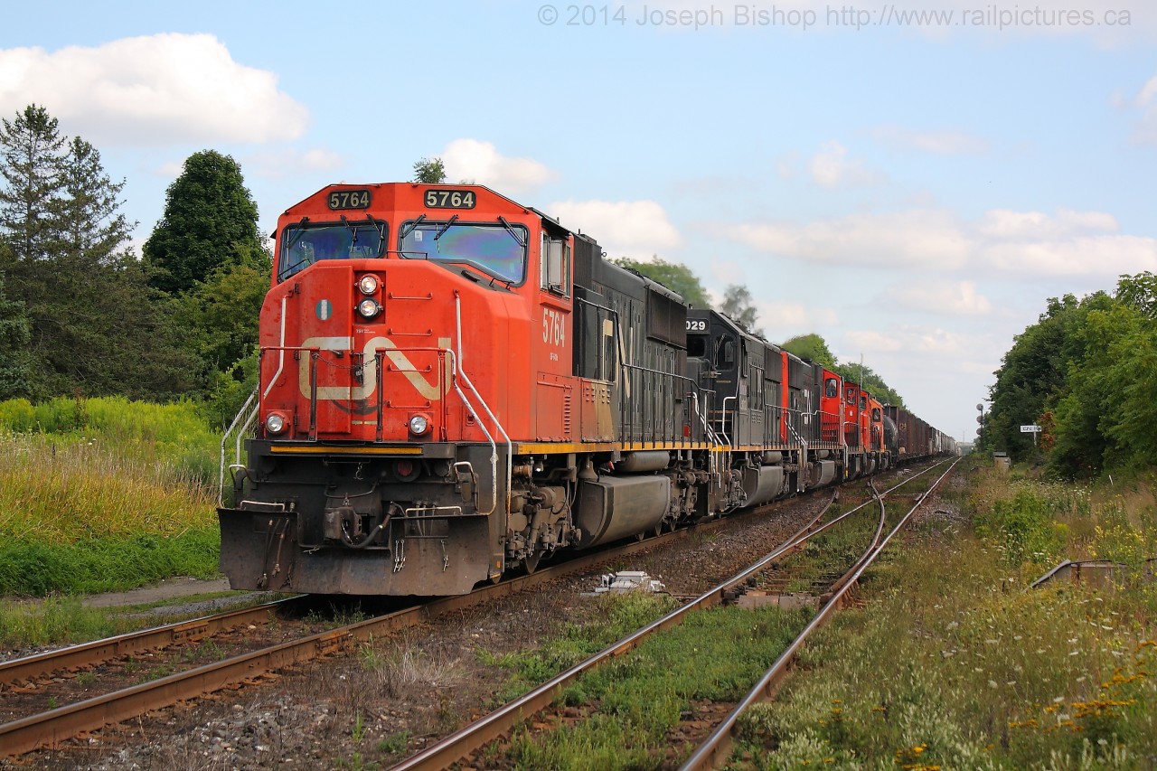 CN 435 throttles up at Hardy Road with a great consist of CN 5764, IC 1029, CN 5645, CN 1412, CN 4770, CN 4729.