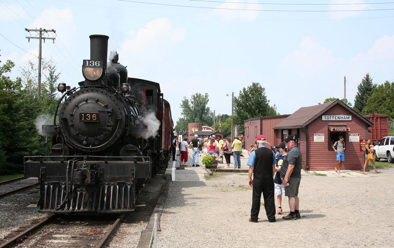 South Simcoe Railway's ex-CP 4-4-0 steam engine 136, built in 1883 for Canadian Pacific by Rogers Locomotive Co., simmers on the main track while passengers for the last excursion run of the day wait to board at Tottenham for the 45 minute out and back run.