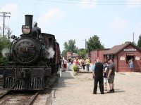 South Simcoe Railway's ex-CP 4-4-0 steam engine 136, built in 1883 for Canadian Pacific by Rogers Locomotive Co., simmers on the main track while passengers for the last excursion run of the day wait to board at Tottenham for the 45 minute out and back run.