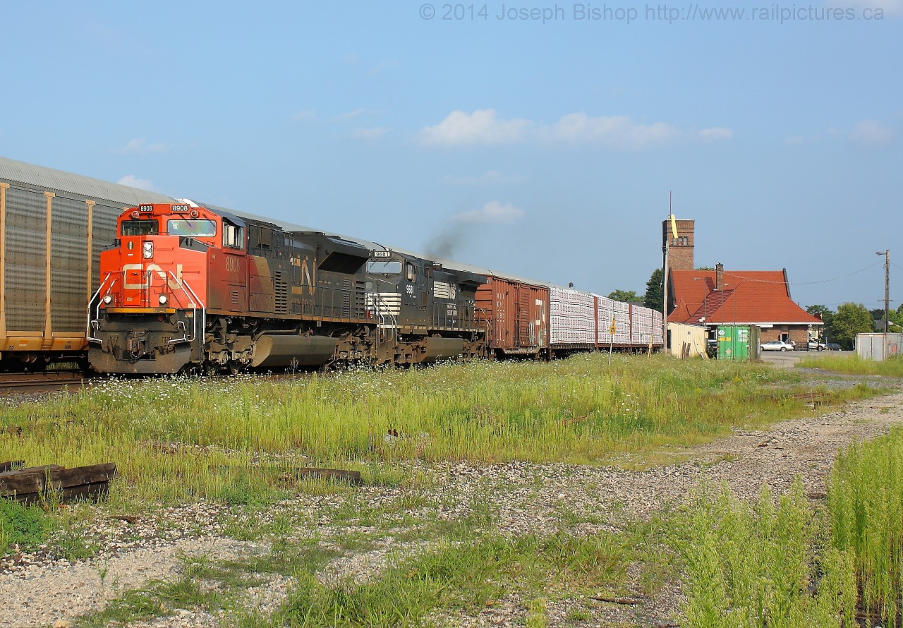 CN 360 gets back up to speed through Brantford after being held at Massey's for a meet with CN 330 before being allowed to go around CN 435 who was working off the North Track in Brantford.  Via 83 was held at Massey's to allow 360 to clear and CN 332 was held at Hardy Road to allow 360, 83 and 435 to all clear.  It made for quite the show after work!