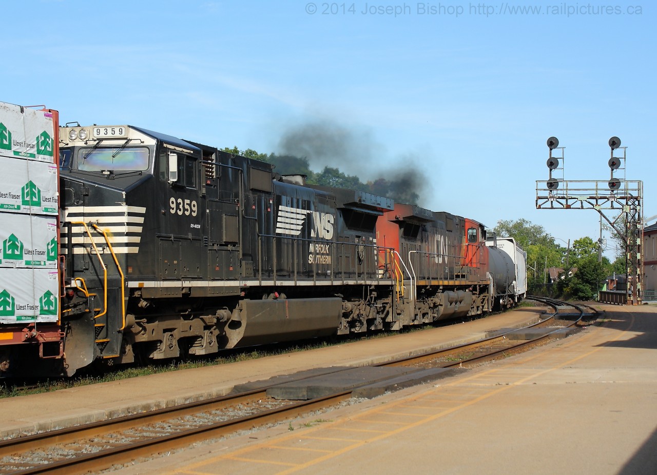 5 o'clock rolled around quite quickly today and as I left the office I found out that CN train 360 was approaching Brantford with Canadian National and Norfolk Southern power.  I pulled into the station about two minutes before the train came into sight with CN 2263, NSS 9705 and NS 9359, CN 2691 as the DPU's.  Pictured are the DPU's on today's 360 providing a bit of a smoke show as the hammer passed me.